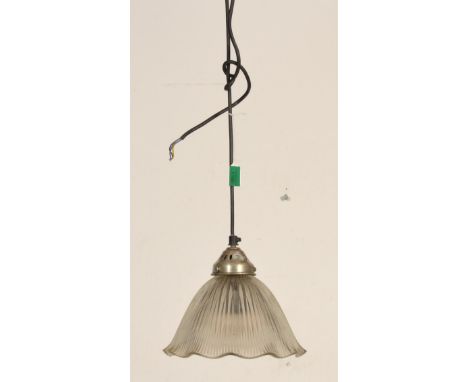 A retro 20th century Industrial factory pendant lamp on shaped arm with holophane glass pendant shade. Measures 21 cm diamete