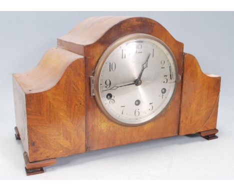 A good early 20th Century walnut cased&nbsp;8 day mantel clock having inset silvered dial with Arabic numeral chapter ring ra