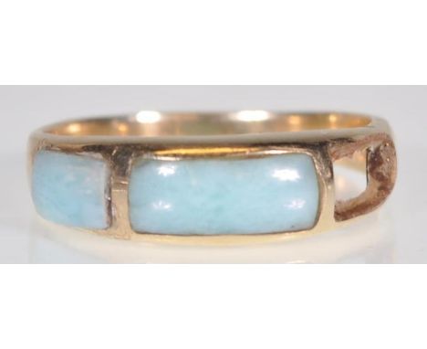 A stamped 14ct gold ring set with blue stone panels to the head. Weight 2.2g. Size N. Please note one stone panel missing.