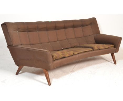 A retro mid century Danish / Scandinavian crescent shaped sofa settee. Raised on square tapering legs with upholstered shaped