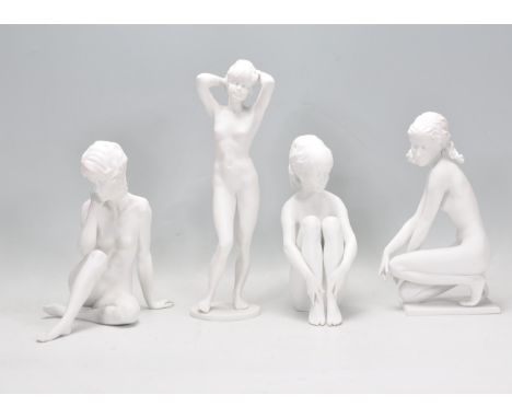 A collection of four German Kaiser porcelain ceramic bisque figurines in the form of nude women, each signed W Gawanika. Mark