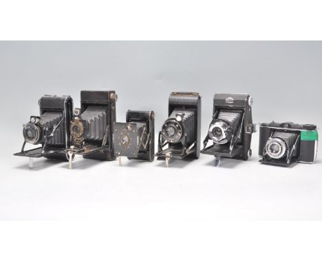 A collection of six vintage folding bellows cameras to include a Agfa Compur, Coronet, Kodak vest pocket, Ross Ensign, Kodak 