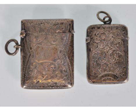 Two English hallmarked antique vesta cases to include a rectangular vesta with engraved foliate decoration and a central cart