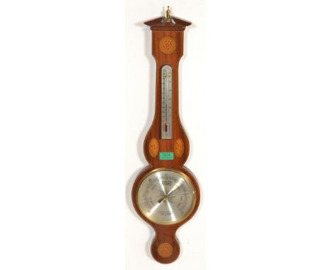 An antique Georgian style mahogany inlaid Comitti of London mahogany barometer having silvered barometer dial and thermometer