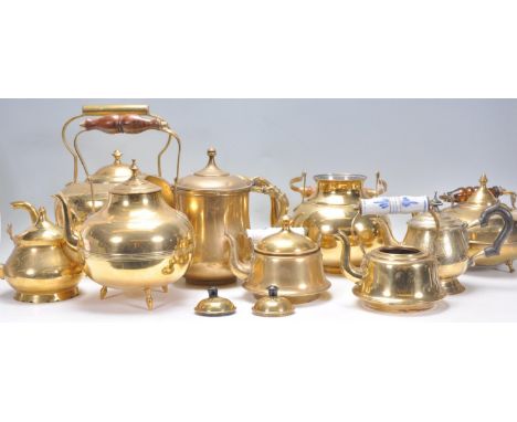 A good group of Victorian 19th Century and later brass kettles to include various types of kettles with a blue and white cera