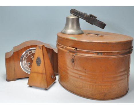 An early 20th century school bell with attached leather strap together with a Victorian hat box trunk, walnut cased metronome