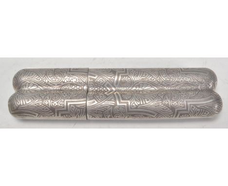 A vintage 20th Century silver white metal&nbsp;spirit flask and cigar case combination with Aztec style engraved decoration. 