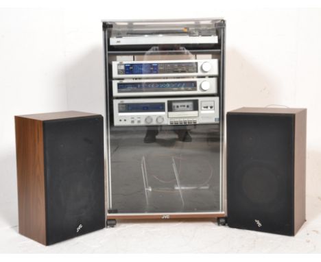 A retro late 20th century hi-fi JVC stacking system complete in the cabinet and with speakers. To include&nbsp; JVC L-A100 tu