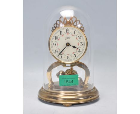 A 20th Century Schatz anniversary clock having a round face with a white enamelled dial having arabic numerals to the chapter