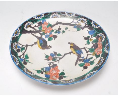 A 19th Century Chinese ceramic plate hand enamelled with birds perched on trees interspersed with flowers and having a floral