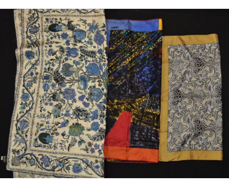 A group of three vintage LIberty printed silk scarves to include a graphic print scarf, a grey graphic floral print scarf and