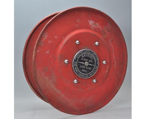 Local Interest - A 20th Century fire hose reel form Bristol City Football Club stadium Ashton Gate. Finished in red with a pl
