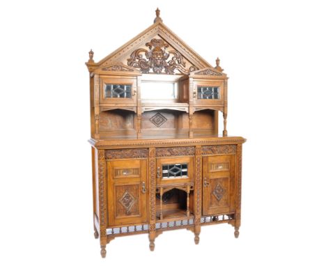 A 19th Century Victorian Arts &amp; Crafts sideboard chiffonier oak mirror back sideboard having a stunning carved pointed pe