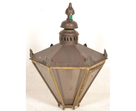 A large late 19th Century Victorian copper and brass effect hanging lantern light of hexagonal form having tapering glass pan
