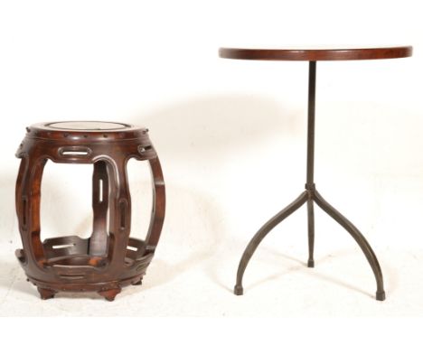 An unusual 20th century mahogany and wrought metal&nbsp; tripod table&nbsp; together with a Chinese hardwood barrel stool wit