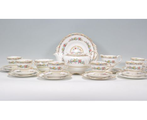 An early 20th century Foley Staffordshire tea service comprising cups, saucers, plates, sandwich plate, creamer, sugar bowl a