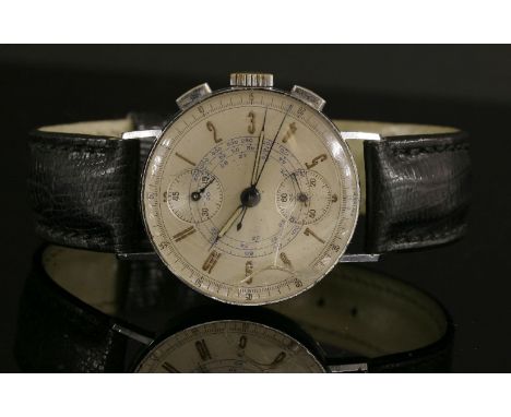 A gentlemen's chrome-plated and stainless steel Swiss chronometer mechanical strap watch,with a Junghans box and guarantee.  