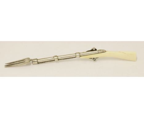 An 18th century silver and ivory fork in the form of rifle,apparently unmarked,in the form of a rifle with carved shoulder st