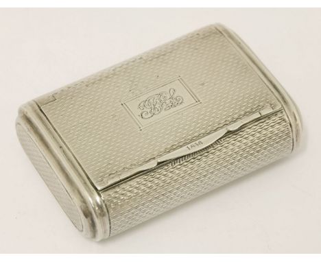 A George III silver snuff box,John Shaw, Birmingham, 1814,curved rectangular with engine turned decoration, monogrammed, with