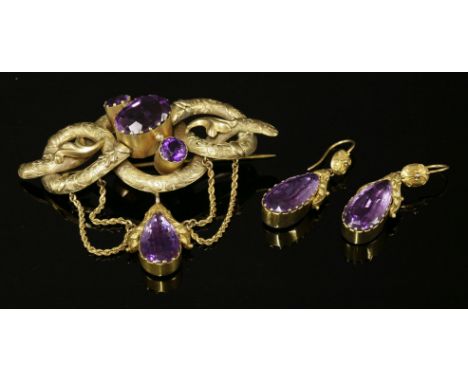 A Victorian gold amethyst brooch and earring suite, c.1870,with a knot-style brooch with three graduated amethysts, claw set 