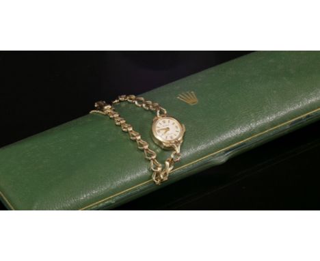 A ladies' 9ct gold Rolex mechanical bracelet watch, c.1950,with a circular silvered dial, with gilt batons and Arabic numeral