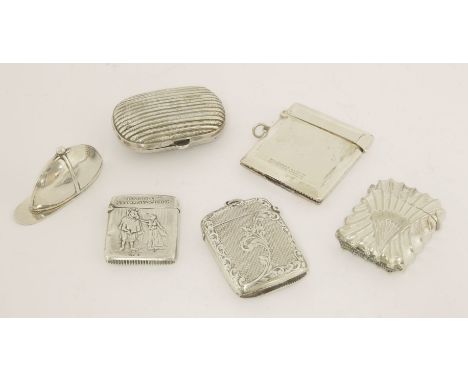 A collection of six silver and white metal vestas,comprising: one Continental, fluted oblong,one in the form of a jockey's ca