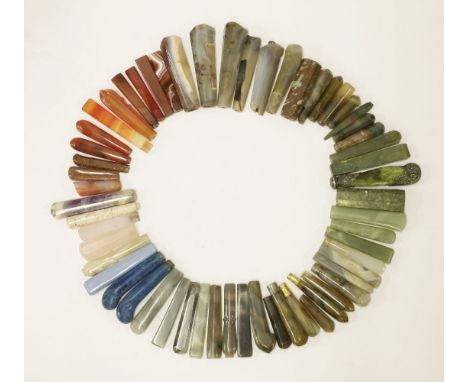 A quantity of assorted of hardstone handles,various forms and sizes, including: green moss agate, cornelian, glass, and ceram