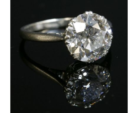 A single stone diamond ring,with an old brilliant cut diamond, estimated as approximately 4.27ct, double claw set to a 'C' sc