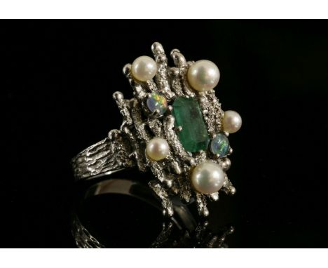 A white gold, emerald, opal triplet and cultured pearl ring, c.1970,an emerald cut emerald, four claw set at an angle to the 