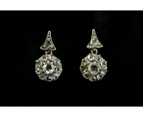 A pair of late Victorian diamond cluster drop earrings,with an arrow point top, grain set with a rose cut diamond.  A circula