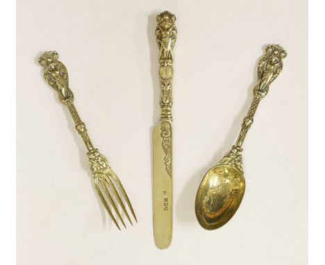 A Victorian silver gilt knife, table fork and spoon,Hunt & Roskell Ltd., London, 1897,rich figure pattern, knife 21.5cm long,