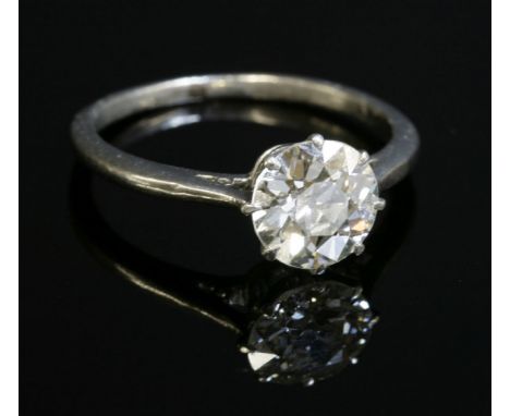 A single stone diamond ring,with an old brilliant cut diamond, estimated as approximately 1.23ct, eight claw set to a plain c