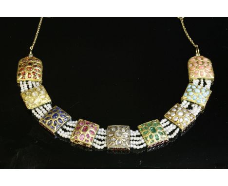 An Indian high carat gold, enamel, diamond and gem set necklace,with a curved centrepiece of gem set rectangular plaques betw