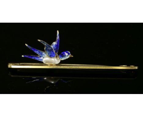 A gold blister pearl and enamel tie pin or bar brooch, c.1925,with a polychrome enamel swallow with a blister pearl body. Mar