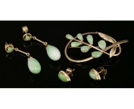 A pair of gold and jade drop earrings,with a circular cabochon jade, claw set to an open frame, articulated bar to a jade pip