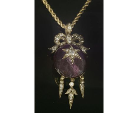 A Victorian amethyst and diamond pendant, c.1860,suspended on a gold rope chain.  An oval cabochon amethyst with an applied s