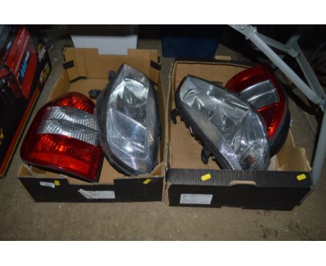 Two boxes containing Vauxhall Zafira lights