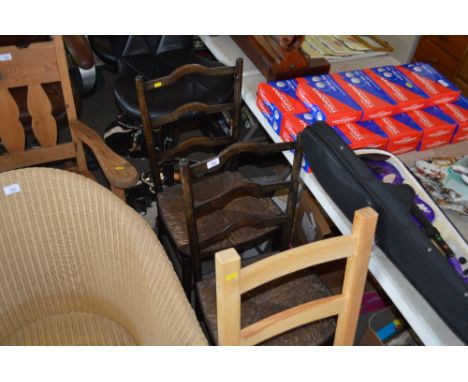 A pair of mahogany ladder back dining chairs