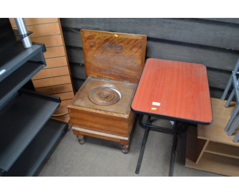 A mahogany commode together with a bed table