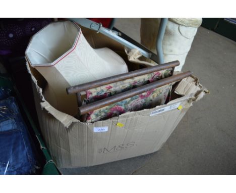 A box containing lamp shades etc