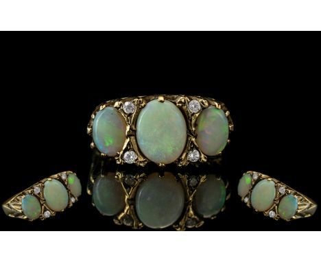 Ladies - Attractive 9ct Gold 3 Stone Opal and Diamond Set Ring. The 3 Large Opals with Diamond Spacers. Gallery Style Setting