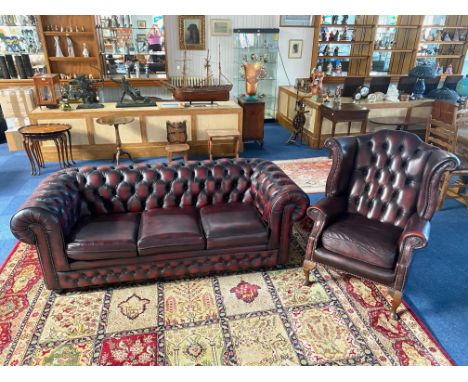 Three Seater Leather Chesterfield Sofa, Oxblood leather, traditional style button back, studded detail to arms.  Measures 80'