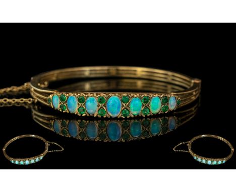 Antique Period - Attractive Well Made 9ct Gold Opal and Peridot Set Hinged Bangle with Safety Chain. The Oval Shaped Opals ( 