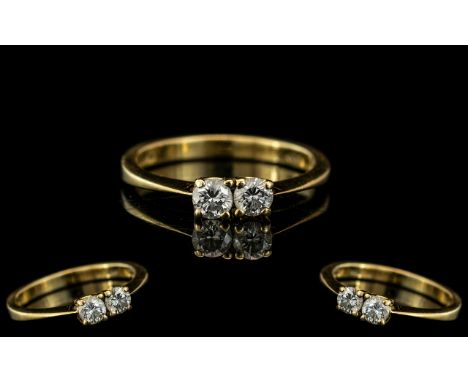 Ladies 18ct Gold Attractive Two Stone Diamond Set Ring. Full 18ct Hallmark to Interior of Shank. The Two Modern Round Brillia