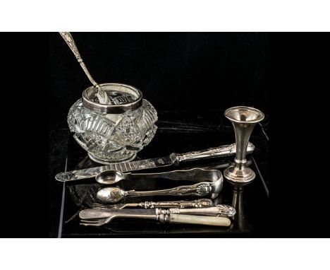 Collection of Silver Items, comprising a pair of tongs, decorative silver handled knife, small butter knife, cake fork, pickl