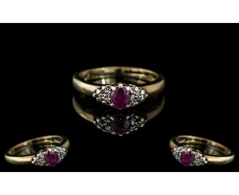 Ladies 18ct Gold - Attractive Ruby and Diamond Set Ring. Full Hallmark to Interior of Shank. The Ruby Flanked by 12 Small Dia