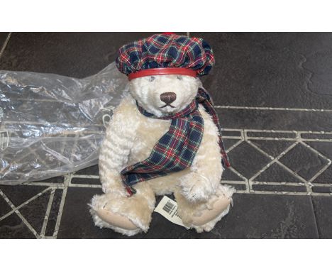 Steiff Teddy Bear, genuine mohair, No. 654459, with growler.  Dressed in tartan tam o'shanter and scarf. Fully jointed.  With