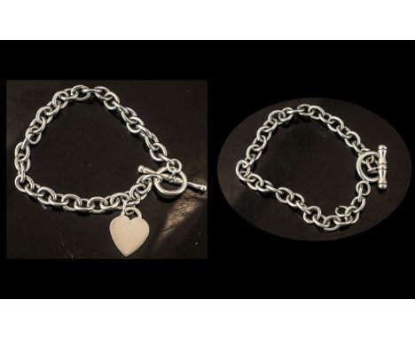 Sterling Silver Bracelet, Tiffany style, with heart charm, toggle fastening, weight 25.8 grams.  Together with on other silve