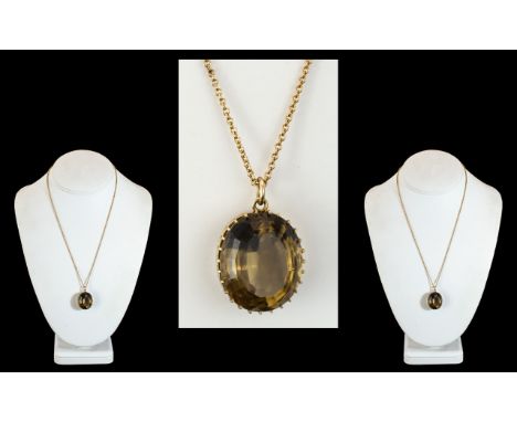 A Large 9ct Gold Smoky Topaz Set Pendant with Attached 9ct Gold Chain. Both Marked for 9.375. The Faceted Topaz Est 10.0 cts.
