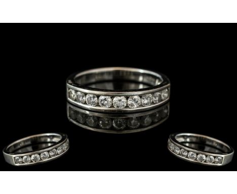 18ct White Gold Diamond Half Eternity Ring, channel set with nine brilliant cut diamonds. Weight .75 ct.  Ring size P.5.